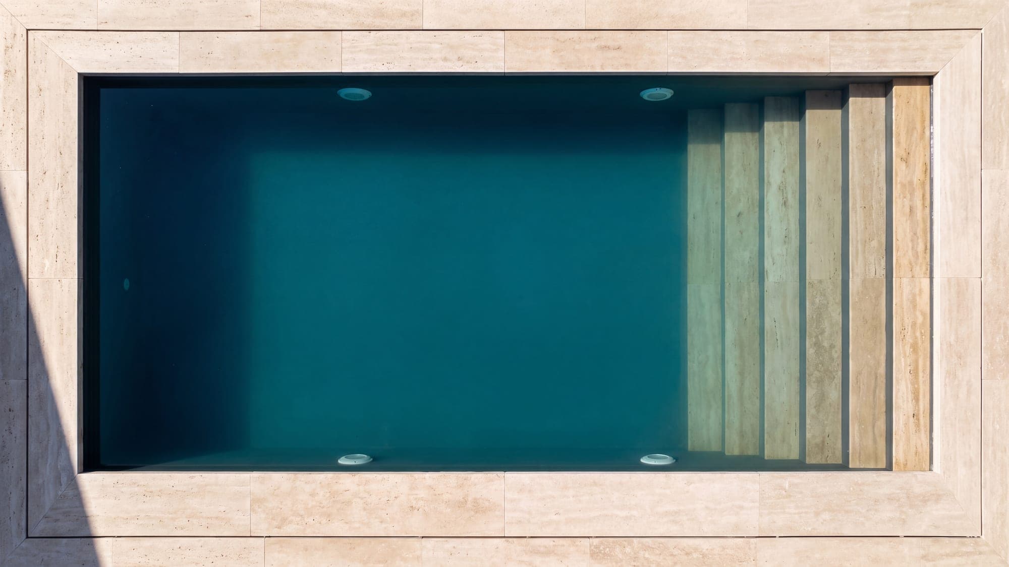 A finished rectangular pool seen from directly above.